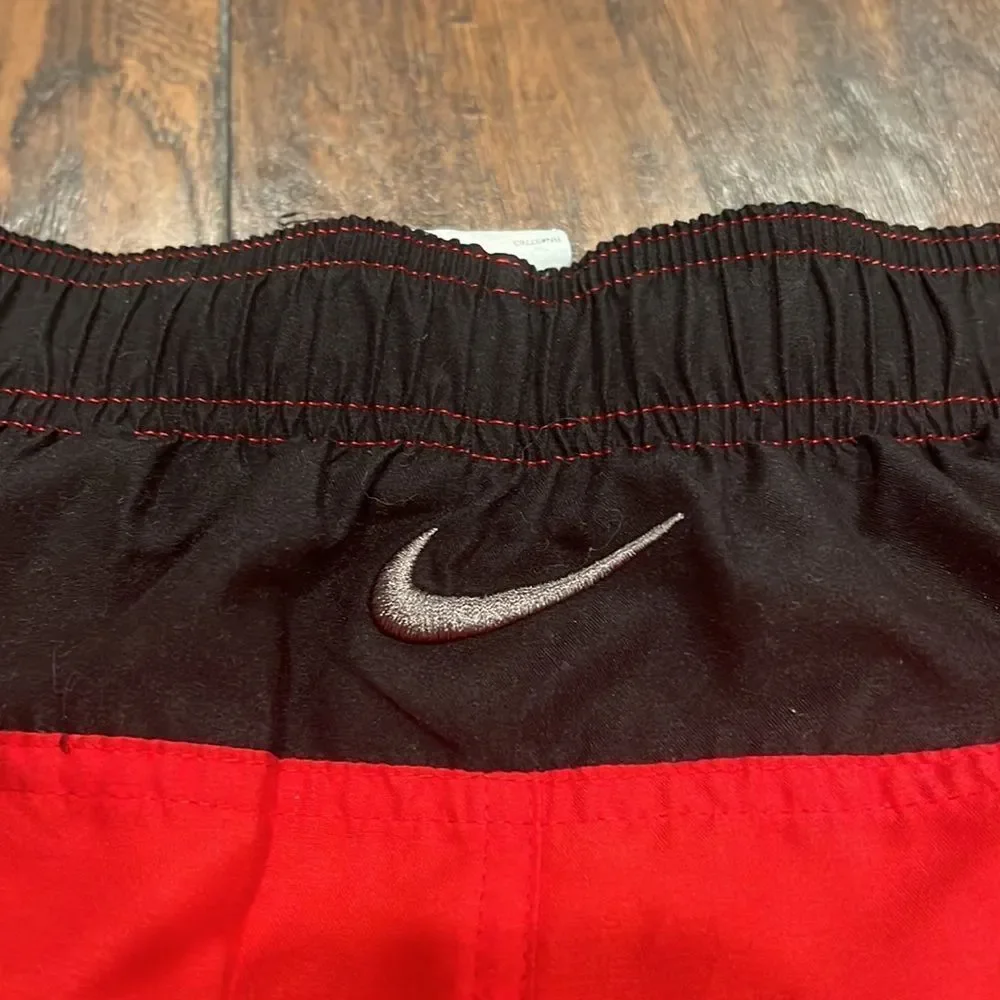 nike swim trunks size L red and black embroidered grey logo EUC with pockets
